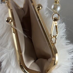 Elegant White Faux Fur Clutch with Gold Accents